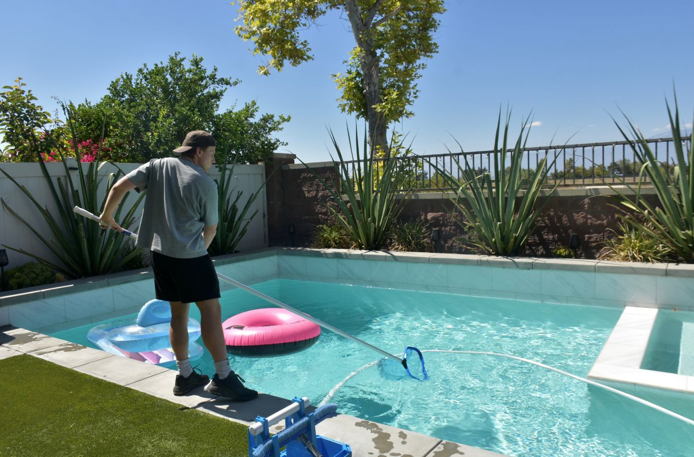A Pool Service and Repair team repairing filtration systems in Rancho Cucamonga, CA, demonstrating the value of trusted local expertise.