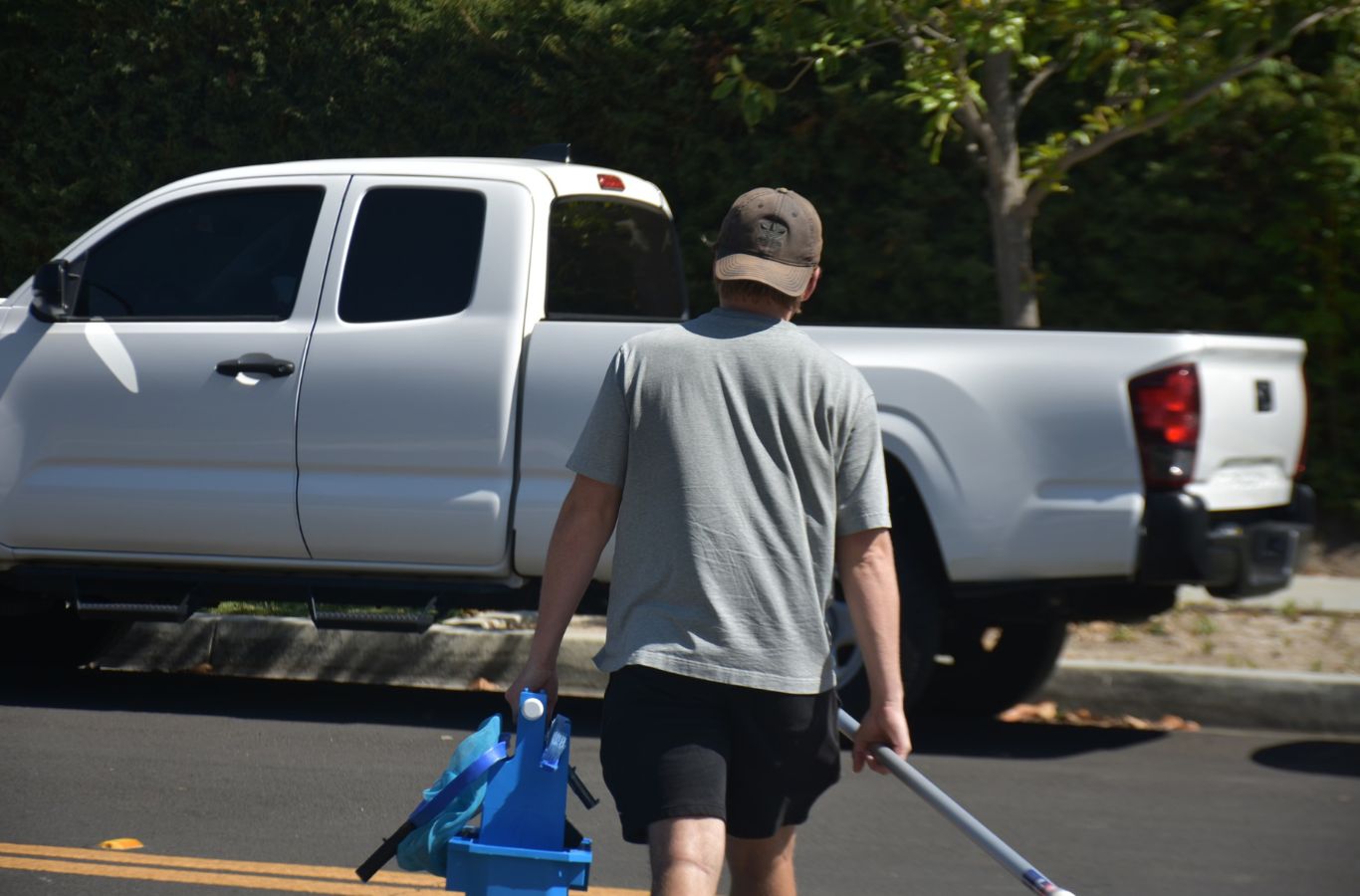 A Pool Service and Repair expert testing water systems during a pool repair in Tustin, CA, highlighting reliability and professionalism. Pool Repair near me.